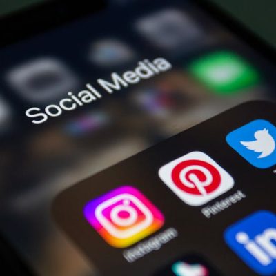A smartphone screen displaying popular social media applications like Instagram and Twitter.